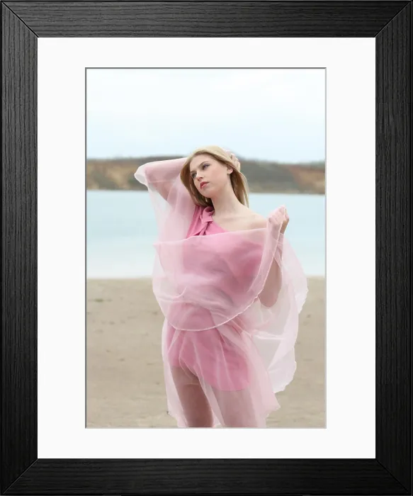 Framed Print : Beautiful blond girl in pink on the beach