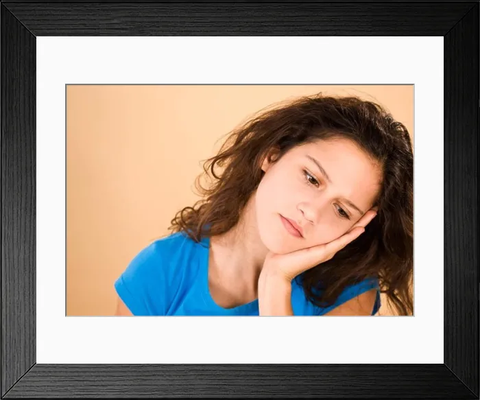 Framed Print : Teenage Girl Leaning Head on Hand Framed Print : Teenage Girl Leaning Head on Hand