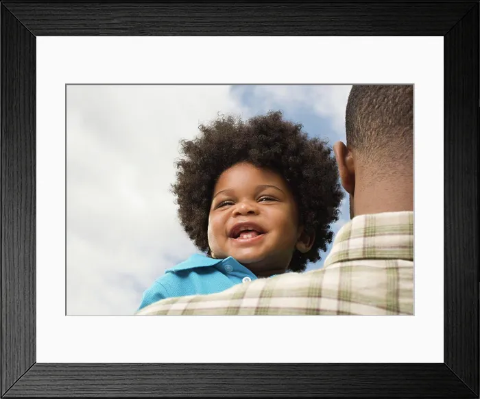 Framed Print : Baby being carried by father Framed Print : Baby being carried by father