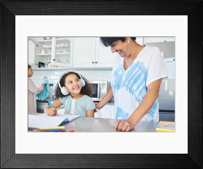 Framed Print : Grandmother, child and laptop for education at house with headphones