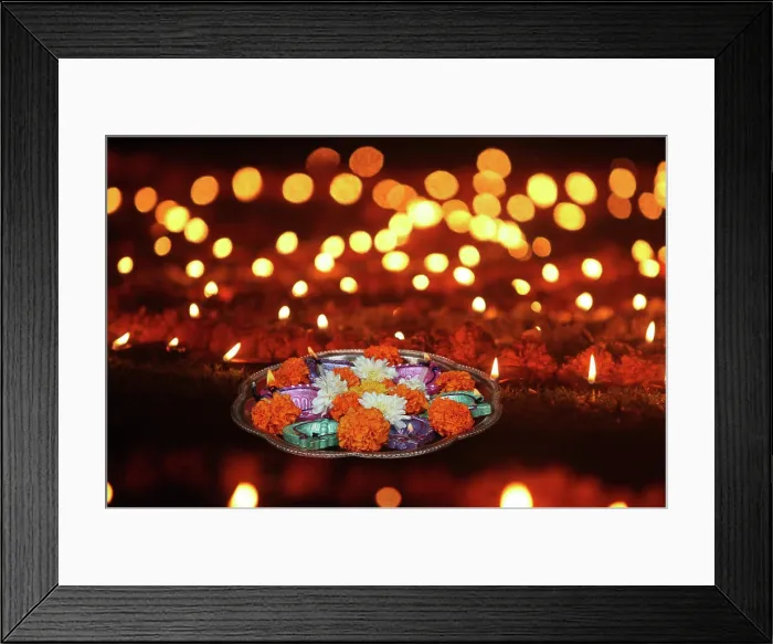 Framed Print : Hindu Ritual in Diwali A plate of lamps and marigold flowers for hindu ritual kept on a lawn with other lamps