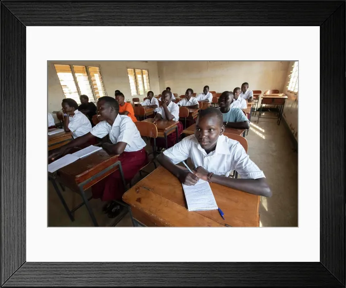 Framed Print : Uganda. Students learn in a small classroom. (Editorial Use Only) Framed Print : Uganda. Students learn in a small classroom. (Editorial Use Only)