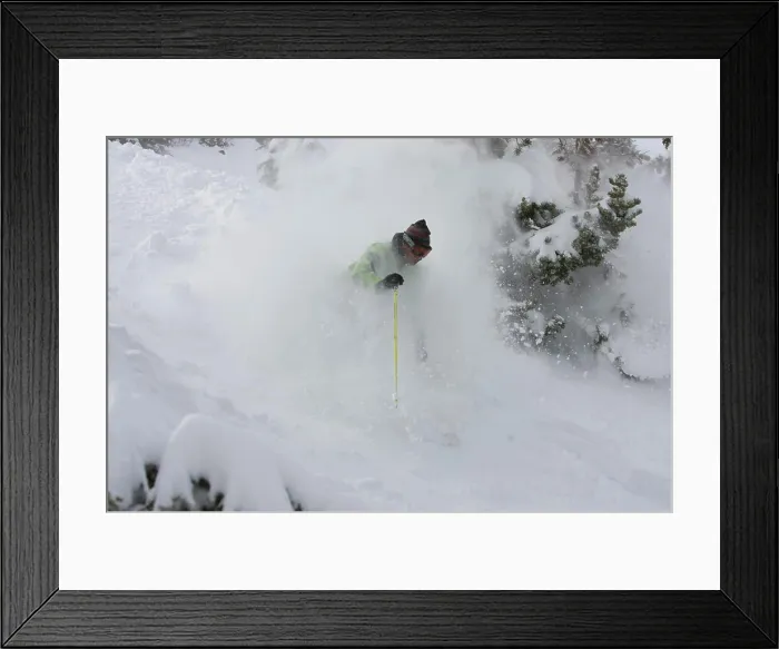 Framed Print : A skier descends a snowy slope through deep powder on a beautiful day in Kirkwood, California Framed Print : A skier descends a snowy slope through deep powder on a beautiful day in Kirkwood, California