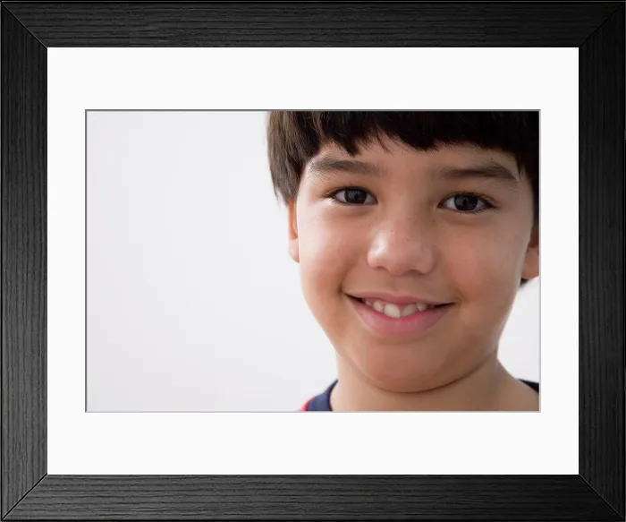 Framed Print : Portrait of a boy smiling Framed Print : Portrait of a boy smiling