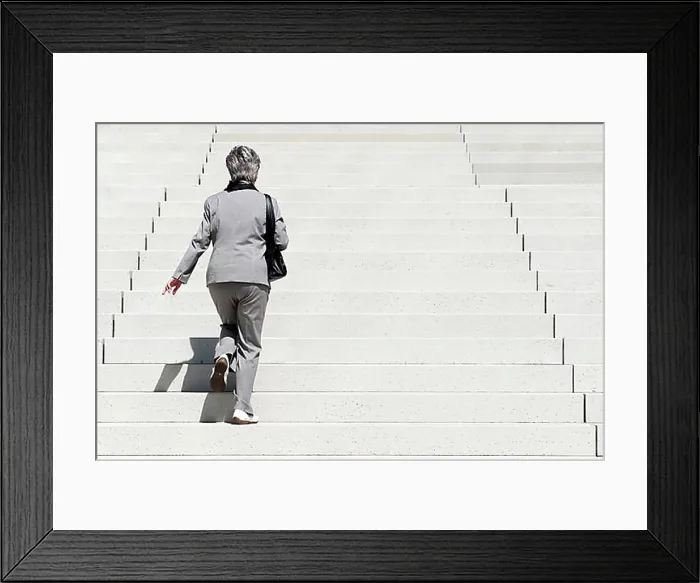 Framed Print : Woman climbing up stairs Framed Print : Woman climbing up stairs