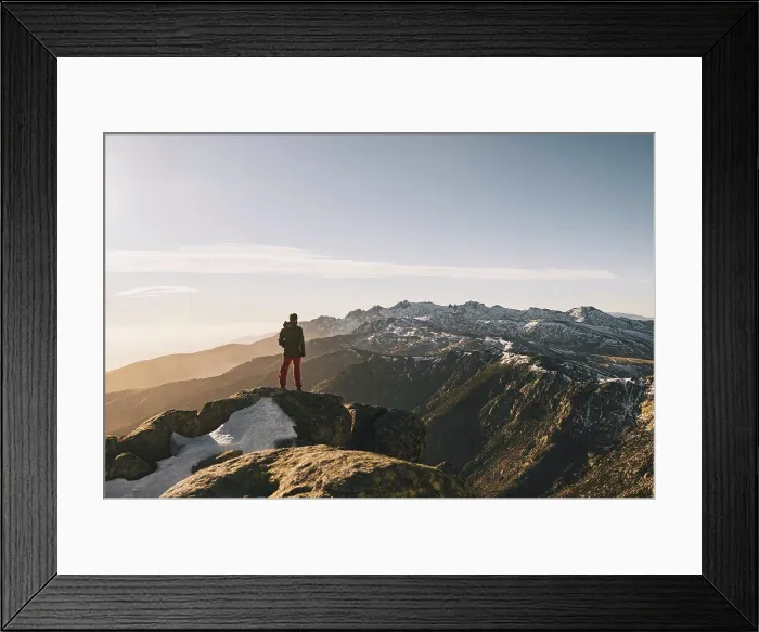 Framed Print : Young man admiring rugged snowcapped mountain landscape at sunset, Gredos, Spain Framed Print : Young man admiring rugged snowcapped mountain landscape at sunset, Gredos, Spain