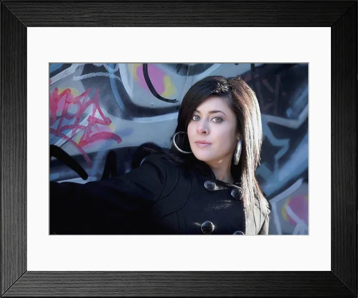Framed Print : a young woman against a wall with graffiti Framed Print : a young woman against a wall with graffiti