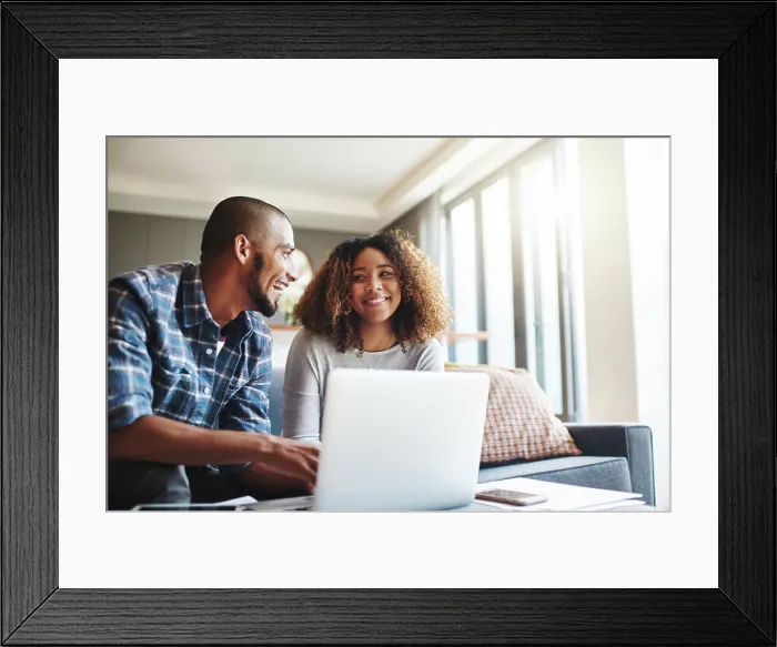 Framed Print : Happy, excited and cheerful couple browsing on laptop and using the internet for payments Framed Print : Happy, excited and cheerful couple browsing on laptop and using the internet for payments