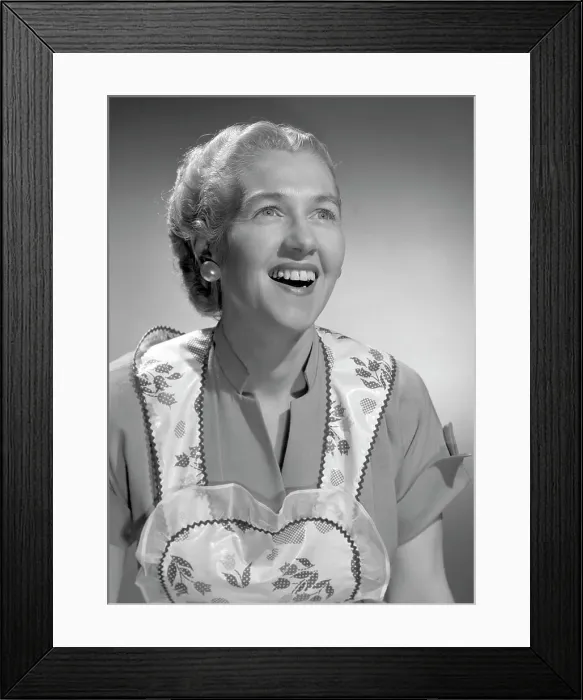 Framed Print : Woman wearing apron, smiling Framed Print : Woman wearing apron, smiling