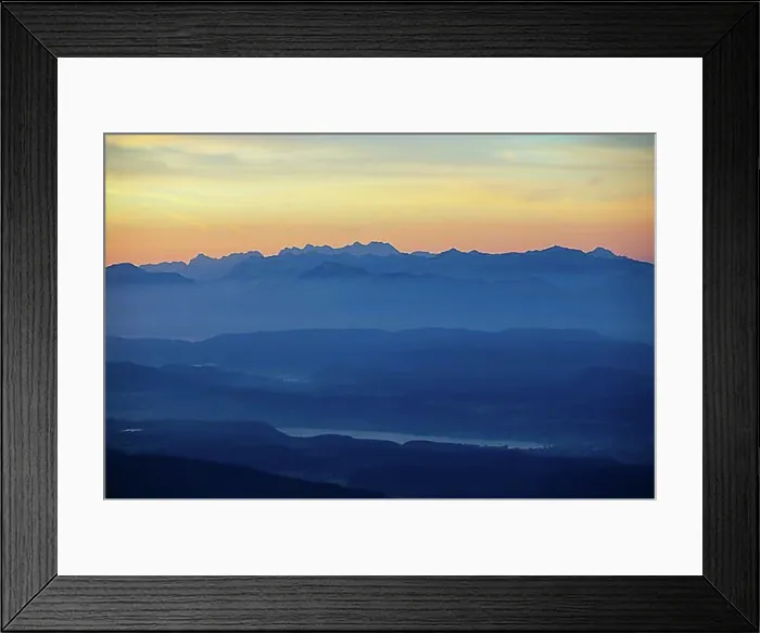 Framed Print : Mountain silhouette, mountains at dawn with a view of the Klagenfurt basin with Lake Lake Woerth and Karawanken Framed Print : Mountain silhouette, mountains at dawn with a view of the Klagenfurt basin with Lake Lake Woerth and Karawanken