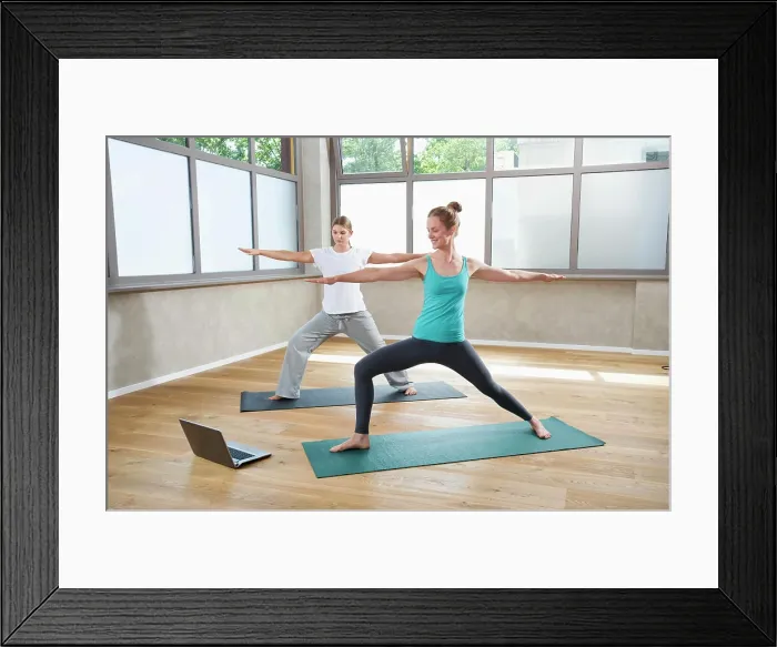 Framed Print : Two women Yoga training fitness studio laptop Framed Print : Two women Yoga training fitness studio laptop