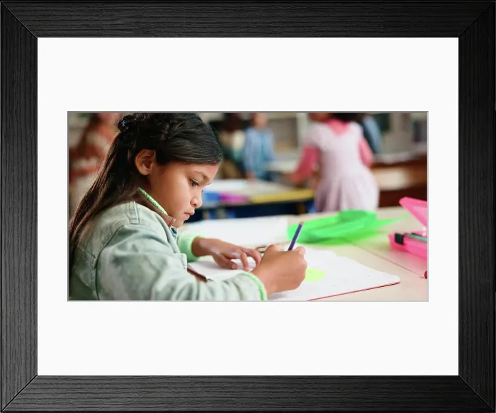Framed Print : Girl, drawing and book for education in classroom Framed Print : Girl, drawing and book for education in classroom
