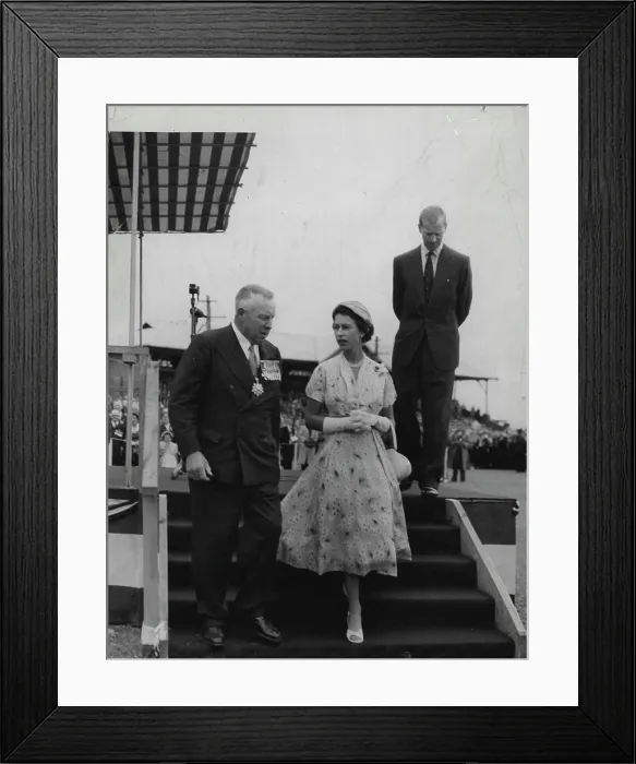 Framed Print : Rally: The Queen descends the dais with Major General Richardson after the Duke (in background) Framed Print : Rally: The Queen descends the dais with Major General Richardson after the Duke (in background)