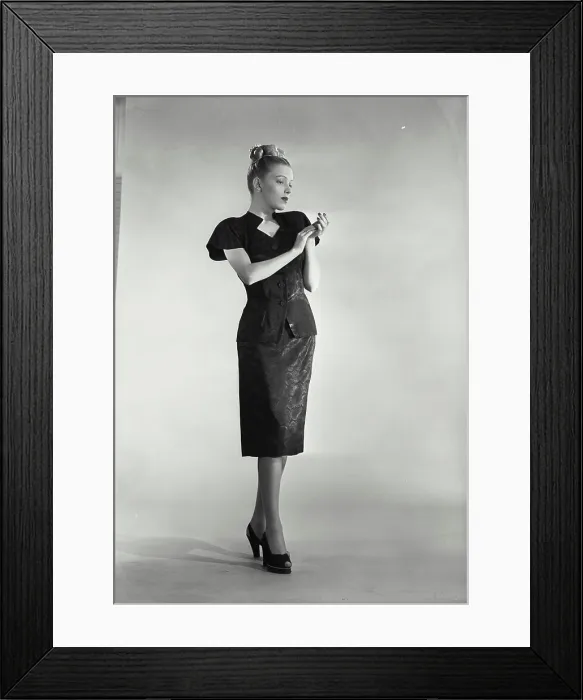 Framed Print : Vintage photograph. Full length view of woman wearing modern dress on solid background Framed Print : Vintage photograph. Full length view of woman wearing modern dress on solid background