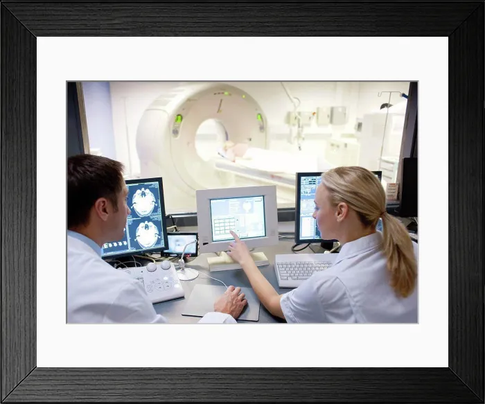 Framed Print : CT scanning. Radiographers taking a computed tomography CT scan of a patient Framed Print : CT scanning. Radiographers taking a computed tomography CT scan of a patient