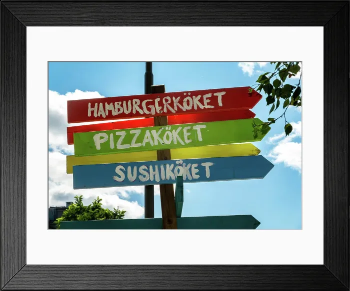 Framed Print : Stockholm, Sweden Colorful signs point to Hamburger, pizza and sushi resturants in a park Framed Print : Stockholm, Sweden Colorful signs point to Hamburger, pizza and sushi resturants in a park
