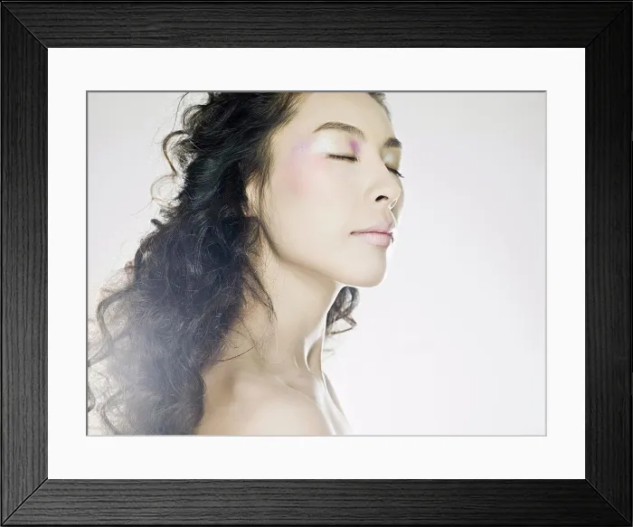 Framed Print : Young woman with eyes closed Framed Print : Young woman with eyes closed