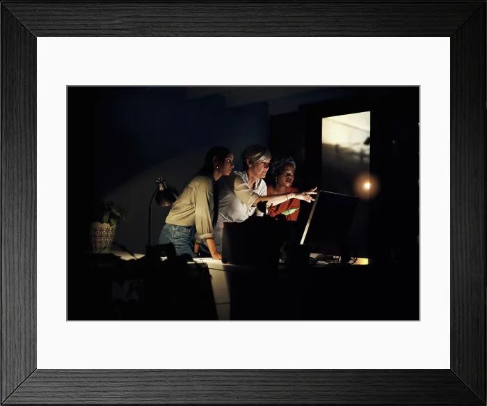 Framed Print : Business team, computer and research at night in office for company project Framed Print : Business team, computer and research at night in office for company project