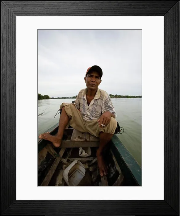 Framed Print : Boatman taking travelers out on Mekong river in Si Phan Don area, Laos Framed Print : Boatman taking travelers out on Mekong river in Si Phan Don area, Laos