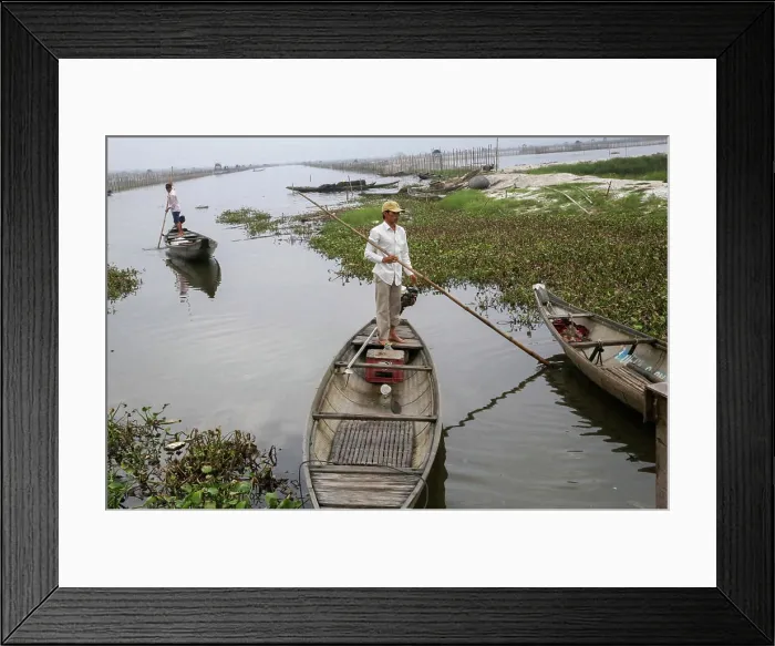 Framed Print : A fisherman from a small fishing village sets out sets out in his canoe in Hue Province Framed Print : A fisherman from a small fishing village sets out sets out in his canoe in Hue Province
