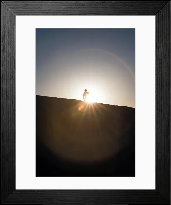 Framed Print : Silhouette of a man standing on a Gypsum dune of White Sands National Monument in New Mexico