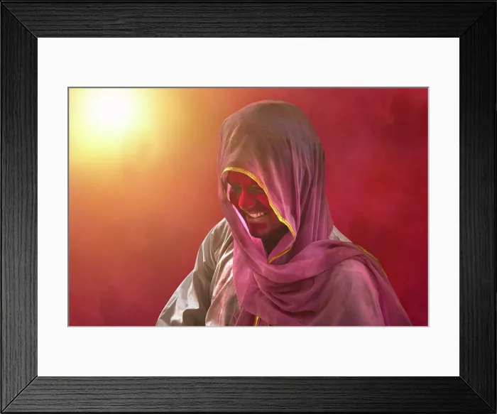 Framed Print : Young Indian man With Colored Face Dancing During Holi Color festival Framed Print : Young Indian man With Colored Face Dancing During Holi Color festival