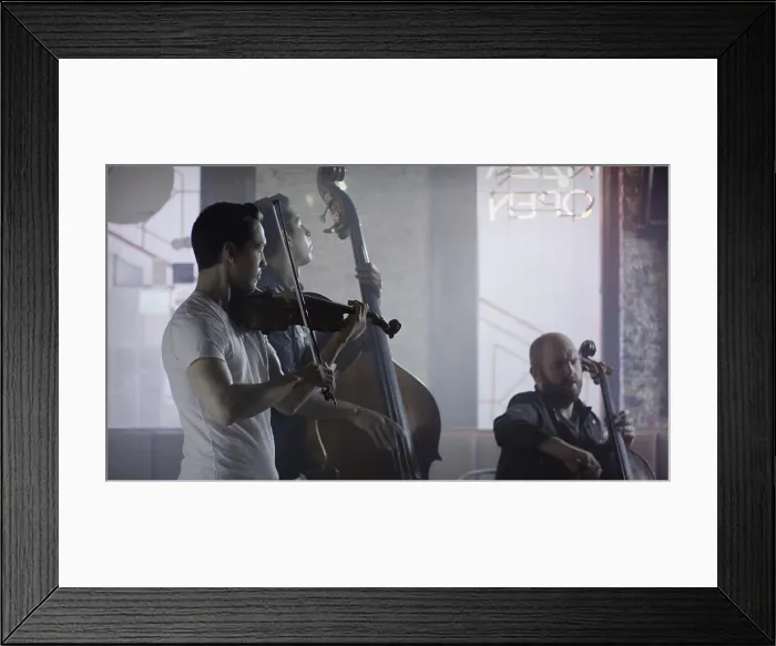 Framed Print : Serious musician playing violin in band in cafe Framed Print : Serious musician playing violin in band in cafe
