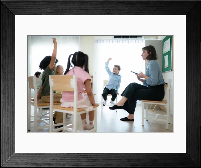 Framed Print : Teacher and students, Learn and study in a classroom of school where youngsters sit and listen attentively Framed Print : Teacher and students, Learn and study in a classroom of school where youngsters sit and listen attentively
