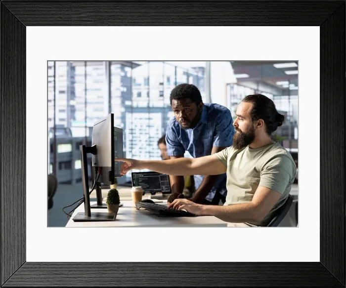Framed Print : Team of programmers fixing applications issues Framed Print : Team of programmers fixing applications issues