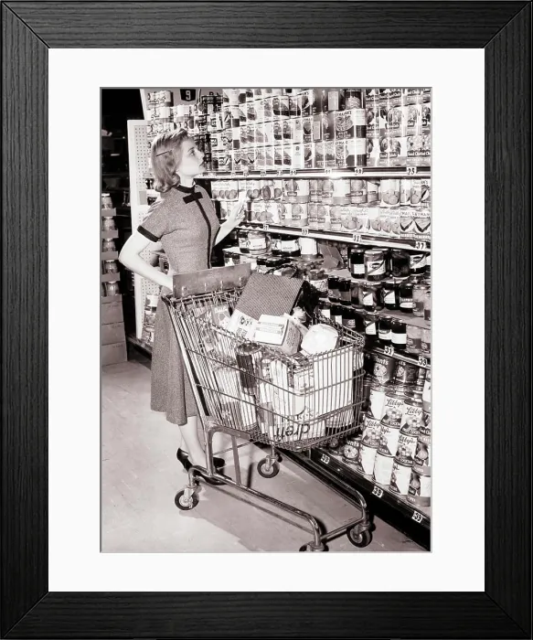 Framed Print : 1950s 1960s WOMAN PUSHING SHOPPING CART IN GROCERY STORE HOLDING HER SHOPPING LIST AND LOOKING UP AT SHELVES OF CANNED Framed Print : 1950s 1960s WOMAN PUSHING SHOPPING CART IN GROCERY STORE HOLDING HER SHOPPING LIST AND LOOKING UP AT SHELVES OF CANNED