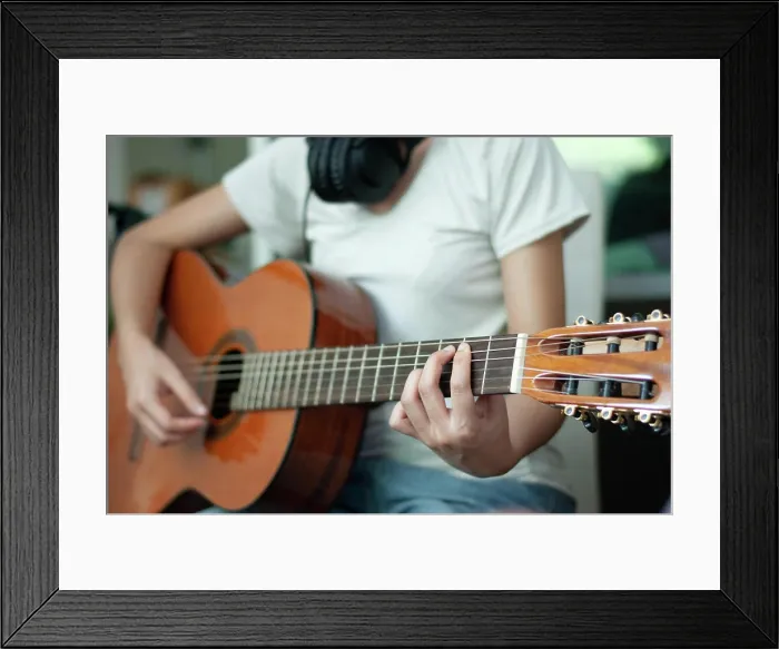 Framed Print : woman's hands playing acoustic guitar, close up Framed Print : woman's hands playing acoustic guitar, close up