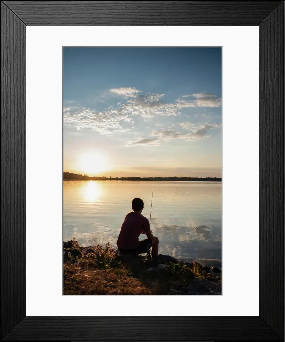 Framed Print : Adolescent boy fishing on shore of lake at sunset in Ontario, Canada Framed Print : Adolescent boy fishing on shore of lake at sunset in Ontario, Canada