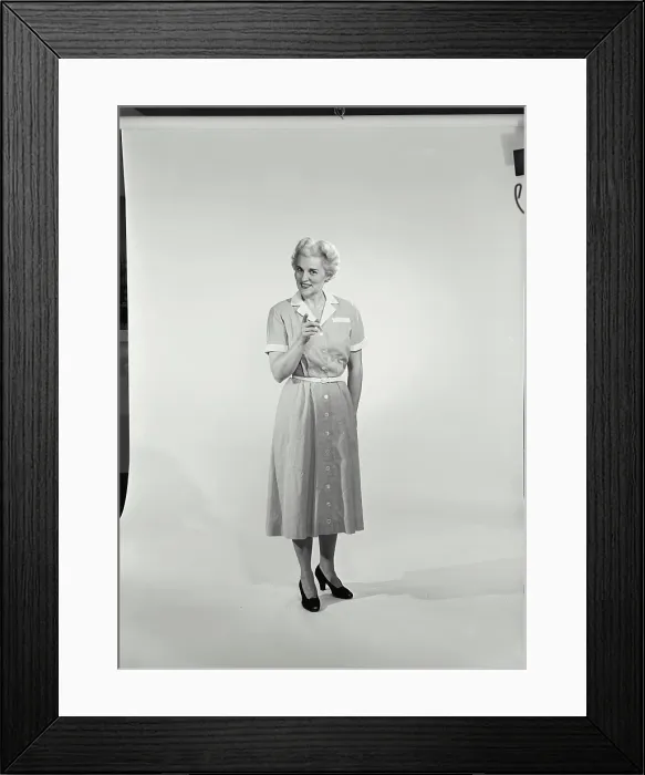 Framed Print : Mature woman standing and pointing forward Framed Print : Mature woman standing and pointing forward