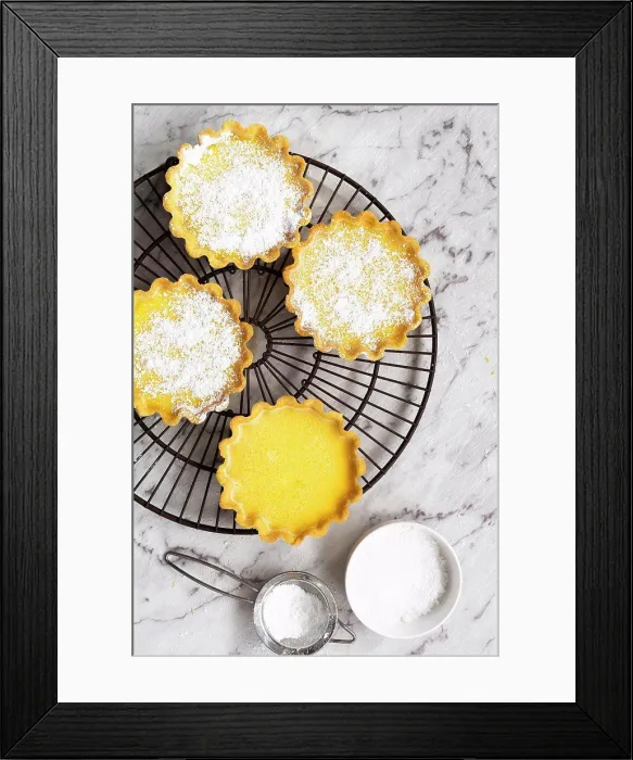 Framed Print : Lemon tarts dusted with icing sugar on a cake rack Framed Print : Lemon tarts dusted with icing sugar on a cake rack