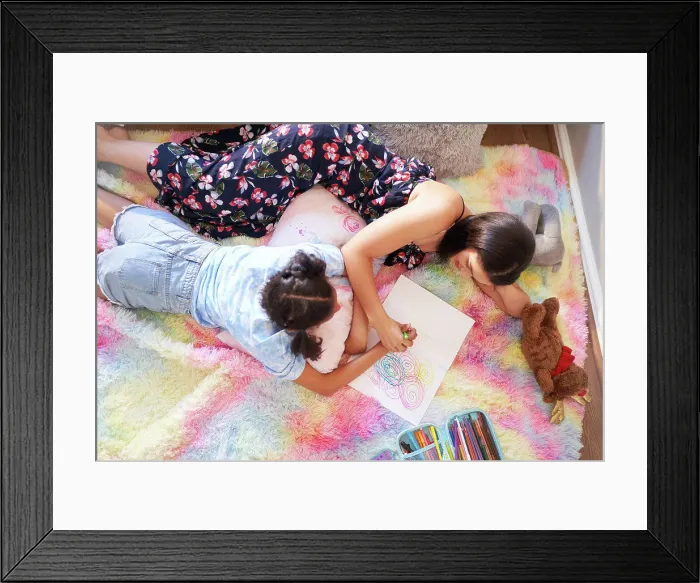 Framed Print : View from above mother and daughter drawing circles in notebook Framed Print : View from above mother and daughter drawing circles in notebook