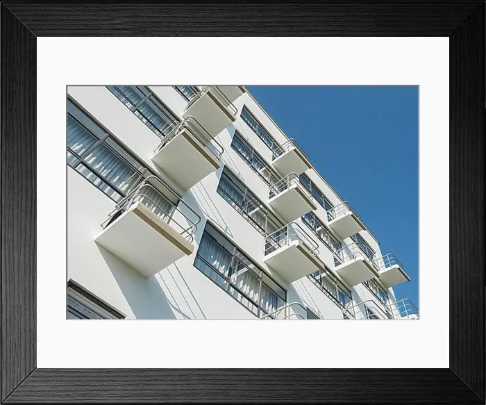 Framed Print : Balconies on the facade of the Bauhaus Dessau with blue sky and sunshine Framed Print : Balconies on the facade of the Bauhaus Dessau with blue sky and sunshine