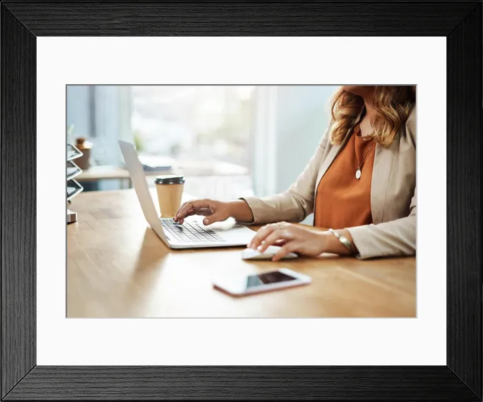 Framed Print : Mouse, laptop and hands of person in office Framed Print : Mouse, laptop and hands of person in office
