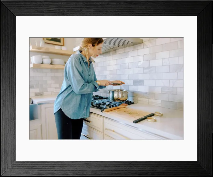 Framed Print : Woman adding spices to butternut squash soup on stove Framed Print : Woman adding spices to butternut squash soup on stove