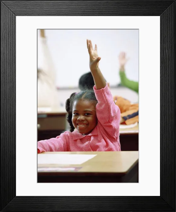 Framed Print : Portrait of a girl raising her hand in class Framed Print : Portrait of a girl raising her hand in class