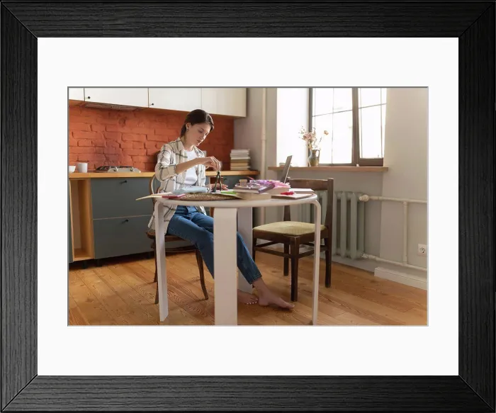 Framed Print : Young woman preparing for exam in kitchen Framed Print : Young woman preparing for exam in kitchen