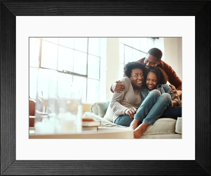 Framed Print : Love, bond and family hugging while relaxing together in the living room of their modern house
