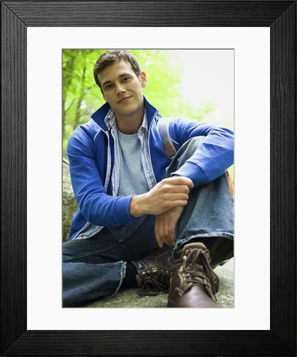 Framed Print : Portrait of a young man smiling Framed Print : Portrait of a young man smiling