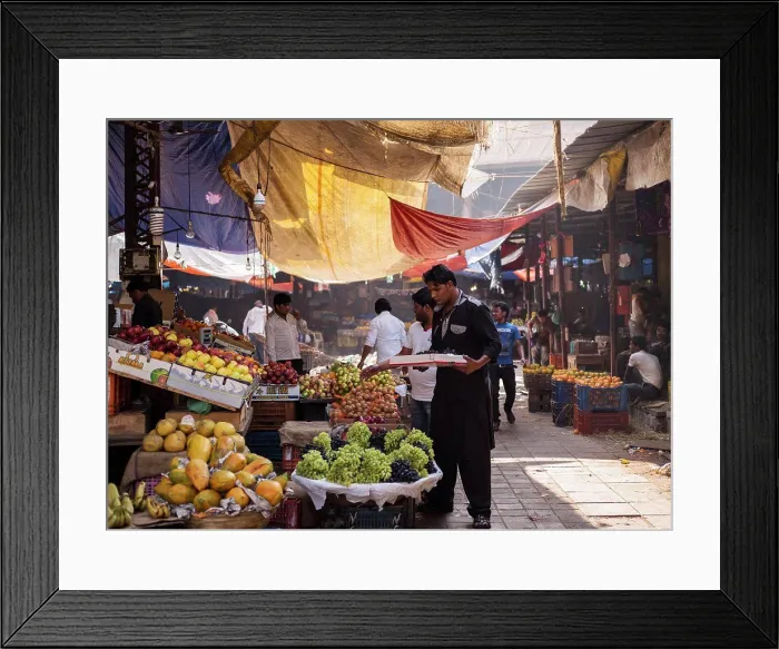 Framed Print : Fruit Vendor stocking fruit supply at outdoor Mumbai Market Framed Print : Fruit Vendor stocking fruit supply at outdoor Mumbai Market
