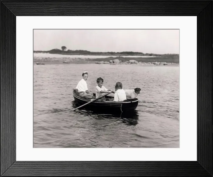 Framed Print : Three children with dog sitting in rowing boat