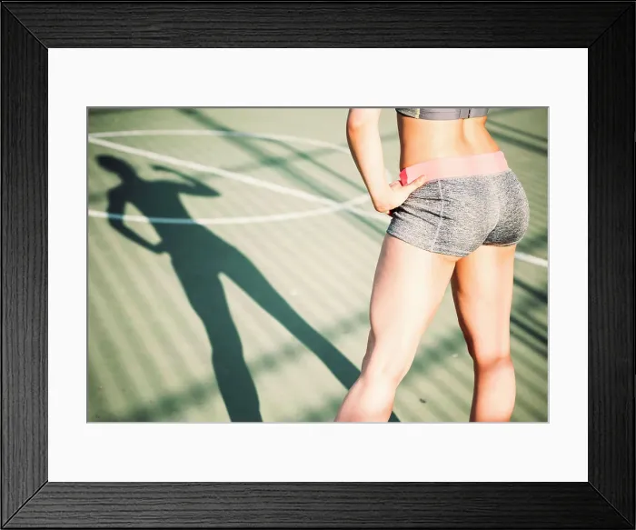Framed Print : Shadow of running woman on a basketball court Framed Print : Shadow of running woman on a basketball court