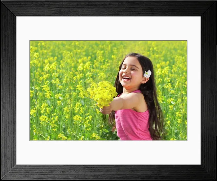 Framed Print : Young girl offering flowers Framed Print : Young girl offering flowers