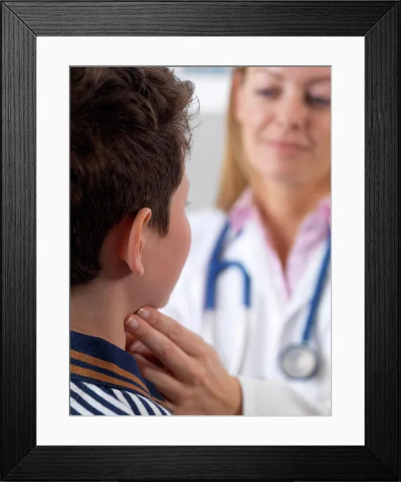 Framed Print : Doctor checking 10 year old boys glands as part of a medical examination Framed Print : Doctor checking 10 year old boys glands as part of a medical examination