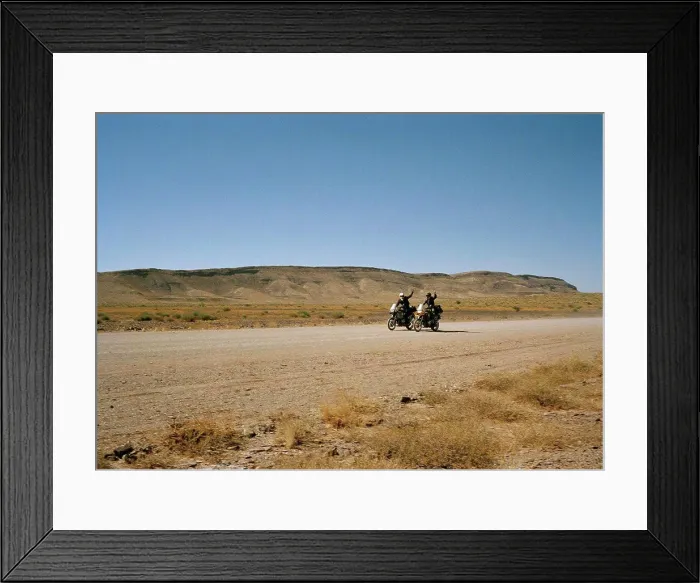 Framed Print : Two motorcyclists waving Framed Print : Two motorcyclists waving