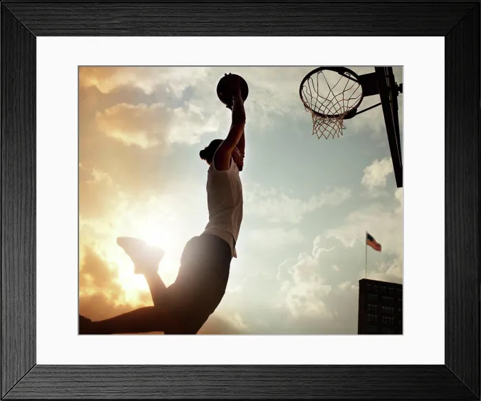 Framed Print : Man dunking basketball on court, New York