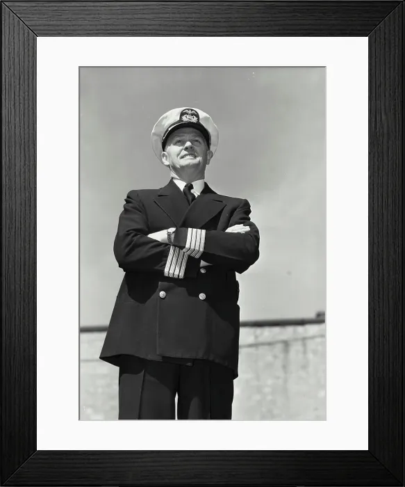 Framed Print : Vintage Photograph. Man in captains uniform standing with arms crossed and smiling Framed Print : Vintage Photograph. Man in captains uniform standing with arms crossed and smiling